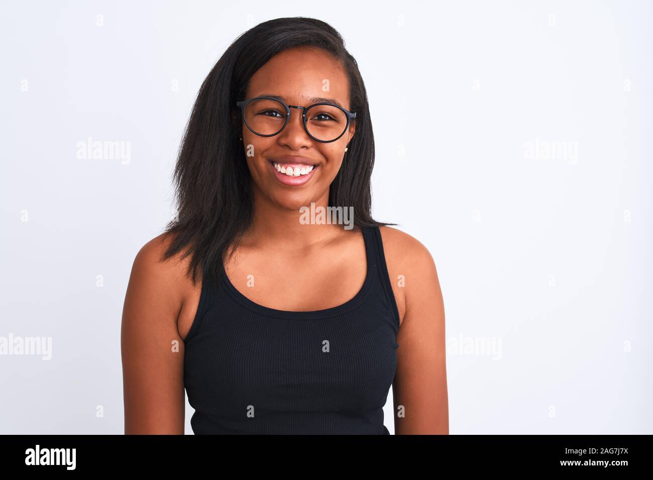 Beautiful young african american woman wearing glasses over isolated ...