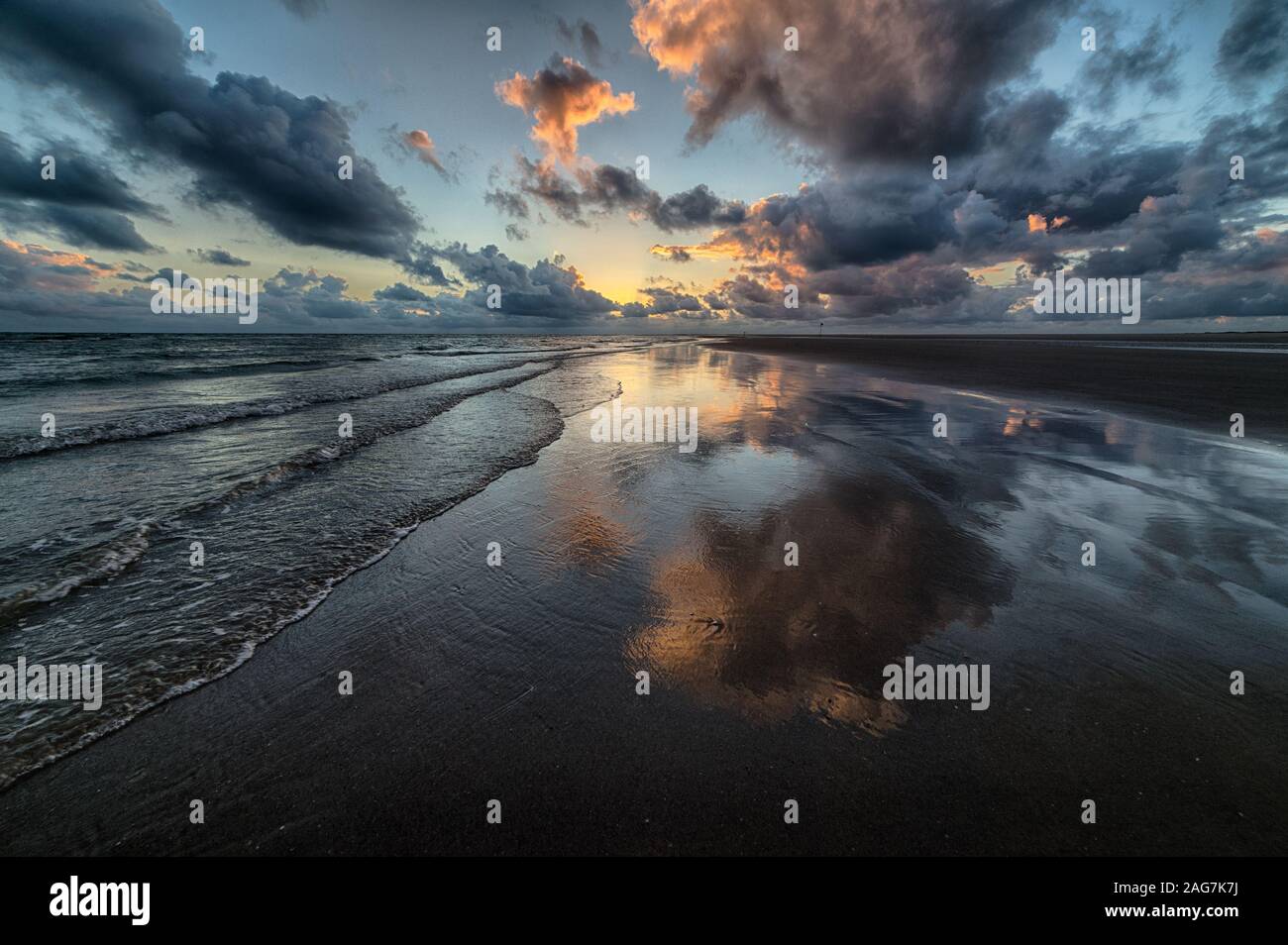 Beautiful shot of the sunset reflecting in the sea Stock Photo