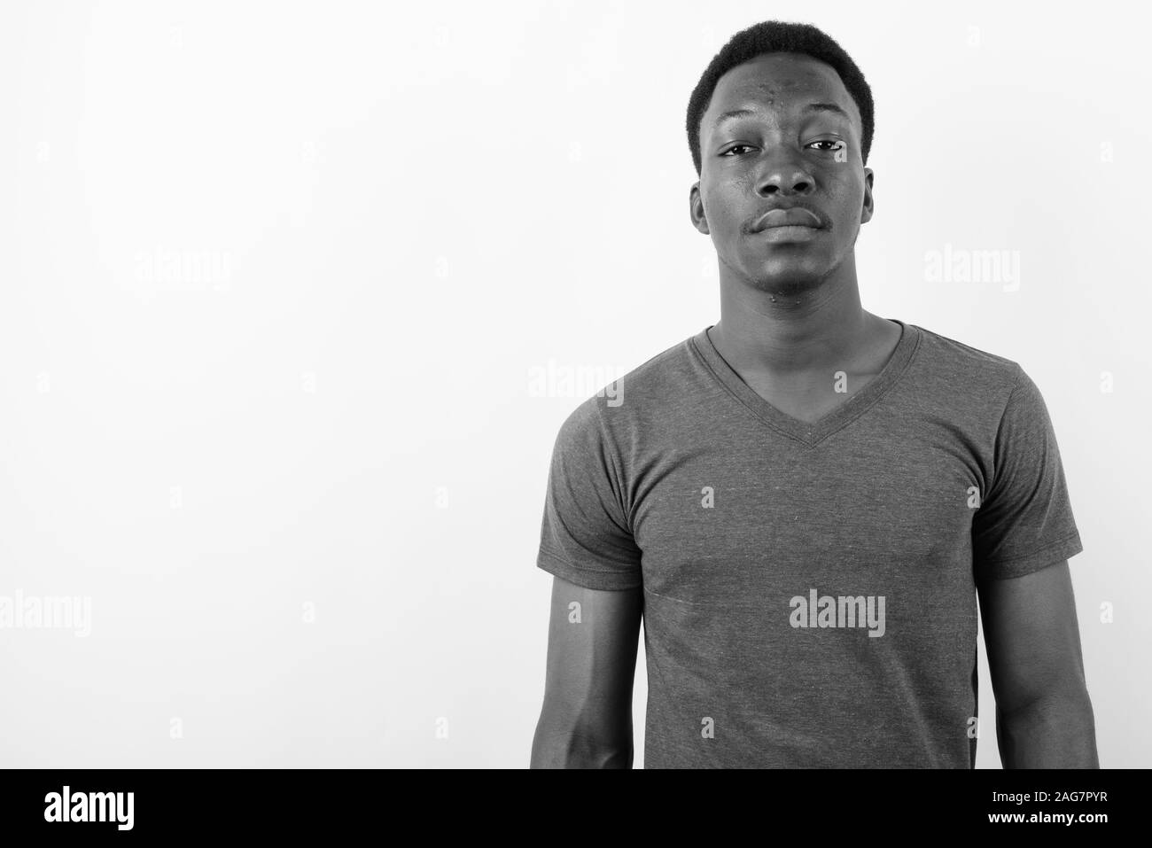 Young handsome African man against white background Stock Photo - Alamy