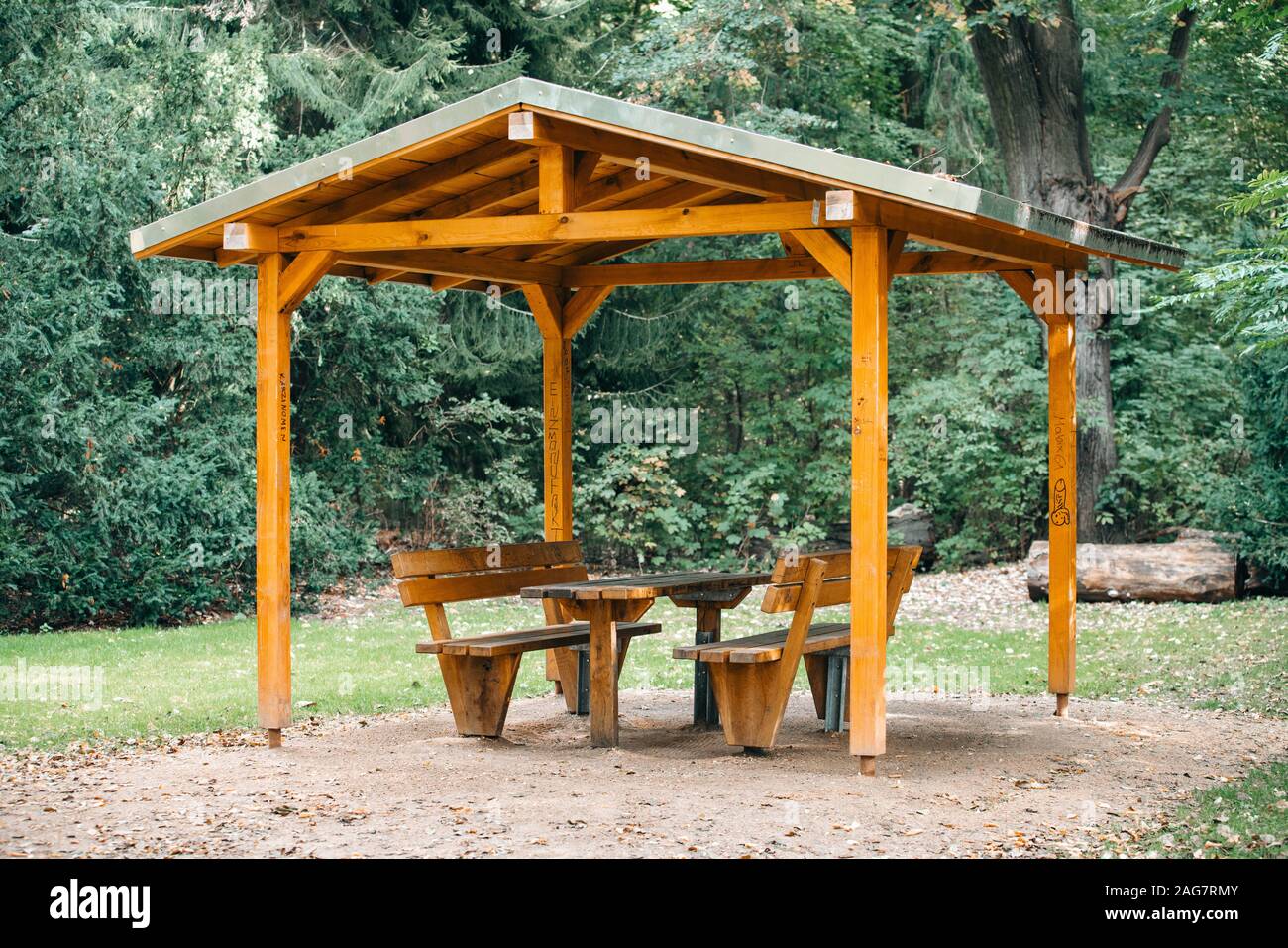 Covered seating area. Gazebo, pergola in parks and gardens - relax and unwind. Wooden gazebo in the Park Stock Photo