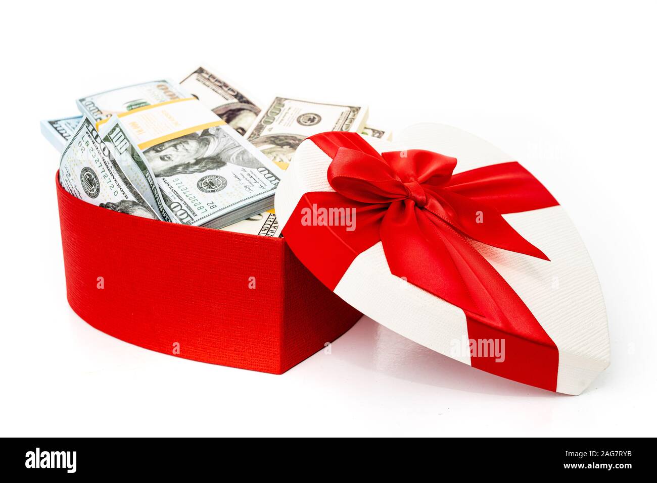 Dollars in a gift box on a white background. Valentine's Day. Birthday.  Saving money Stock Photo - Alamy
