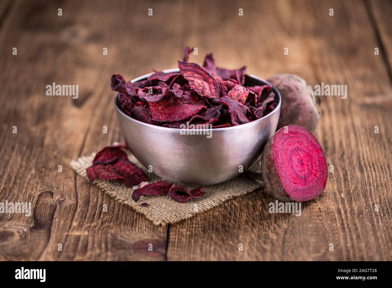 Some fresh Beetroot Chips on wooden background (selective focus; close-up shot) Stock Photo