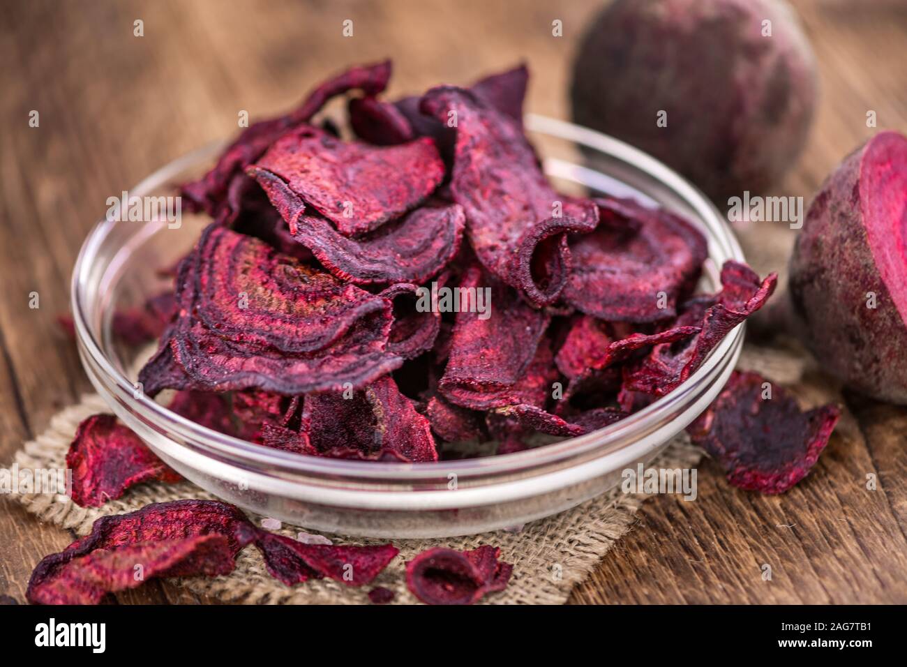 Some fresh Beetroot Chips on wooden background (selective focus; close-up shot) Stock Photo