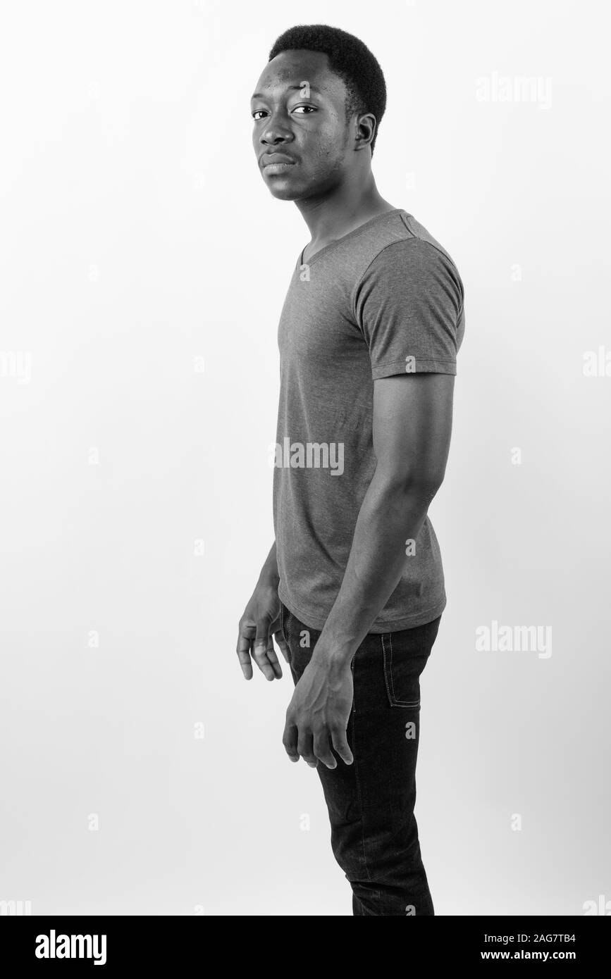 Young handsome African man against white background Stock Photo - Alamy