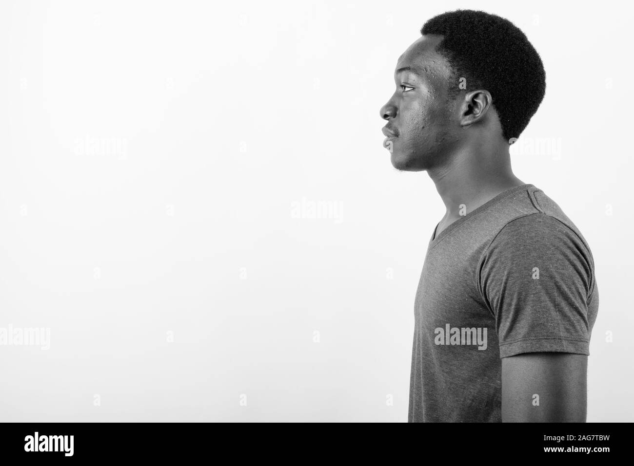 Young handsome African man against white background Stock Photo - Alamy