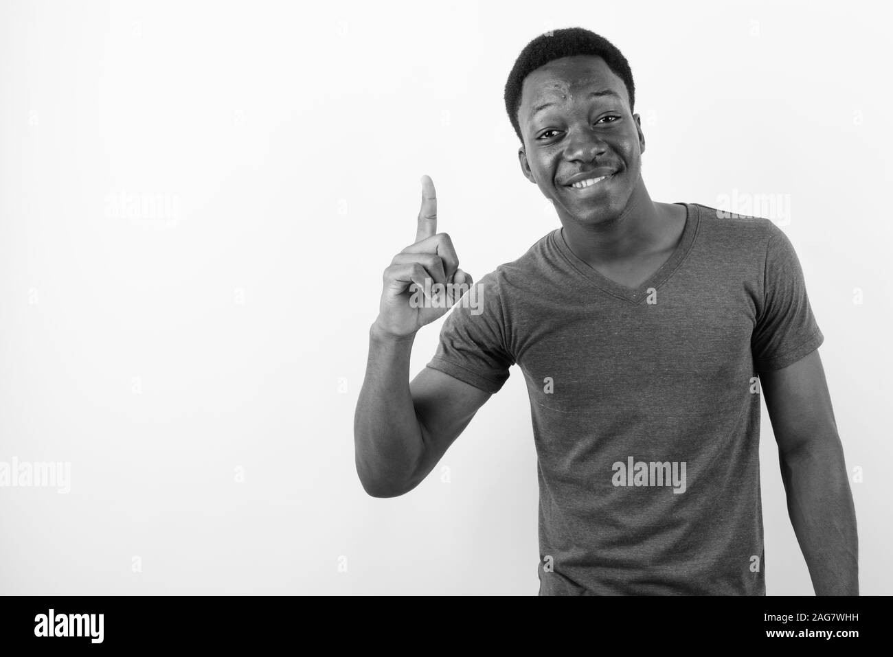 Young handsome African man against white background Stock Photo - Alamy