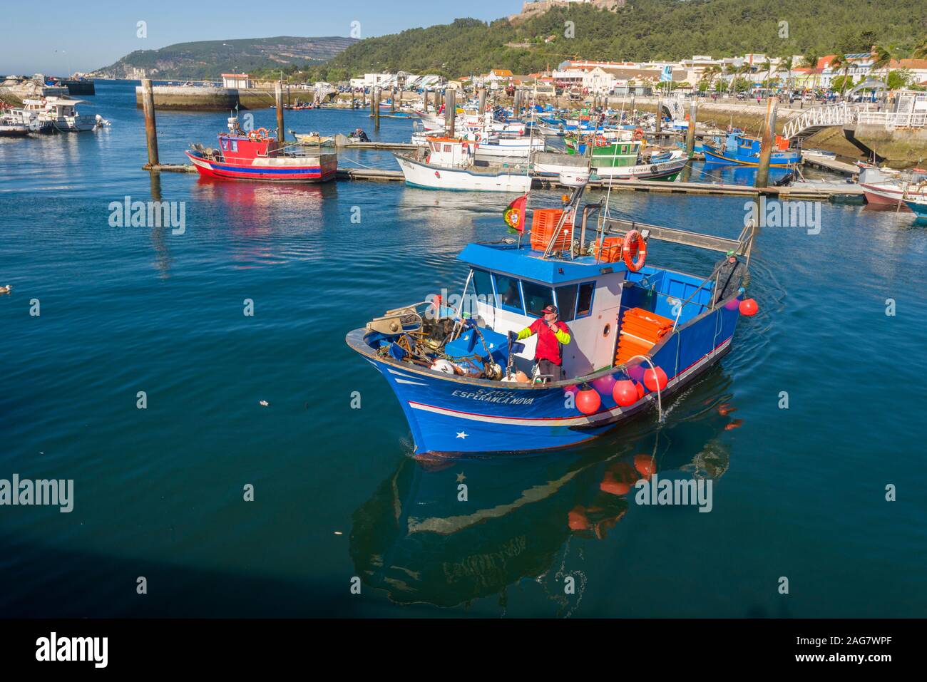 return of fishing boats to the fish market in the port of Setubal Portugal Stock Photo