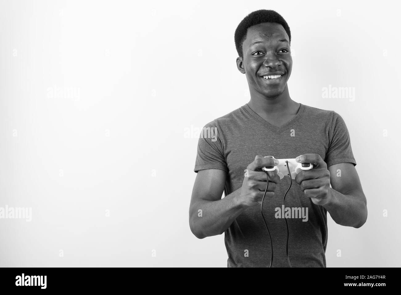 Young handsome African man against white background Stock Photo - Alamy