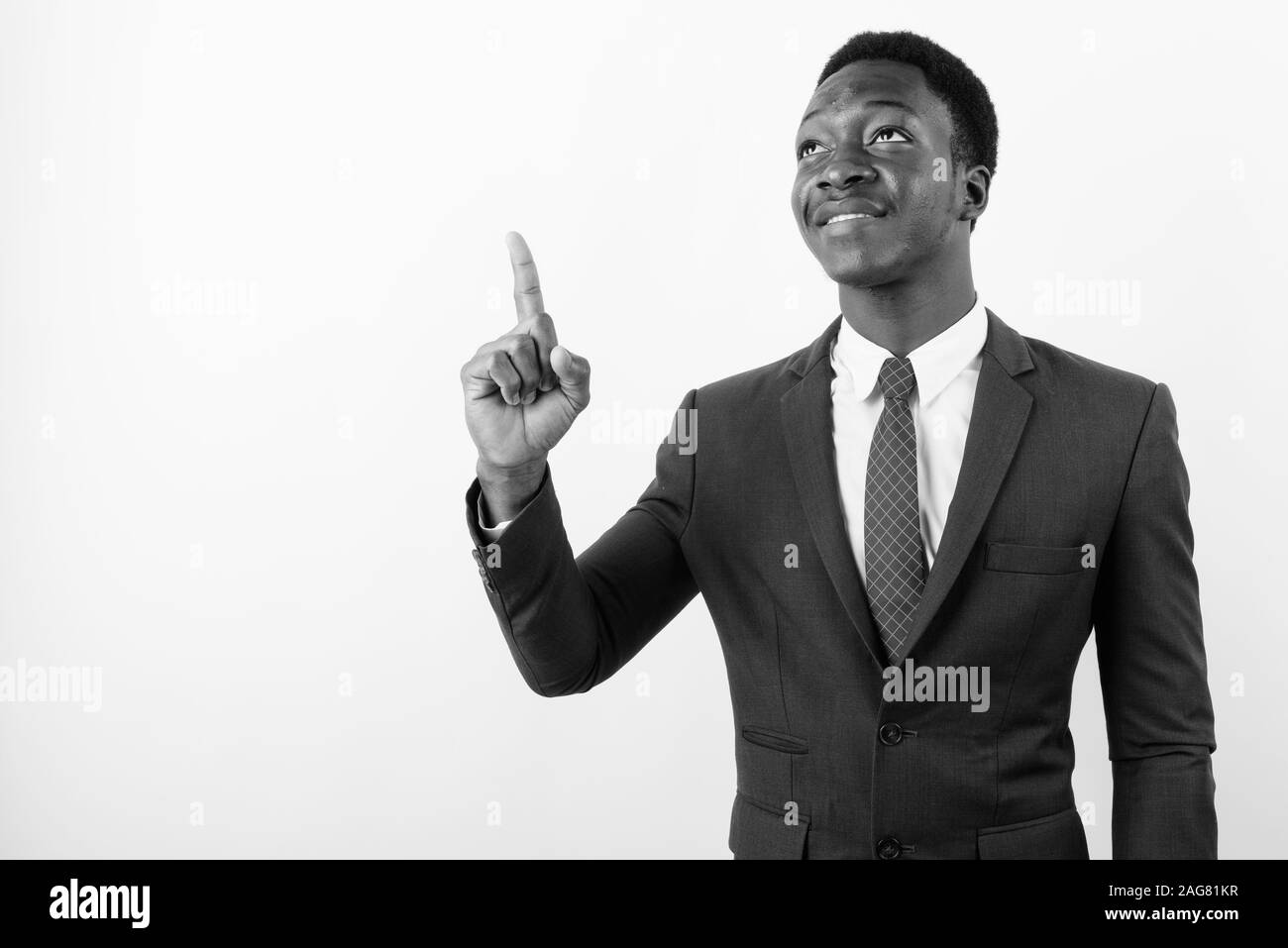 Young handsome African businessman wearing suit against white ...