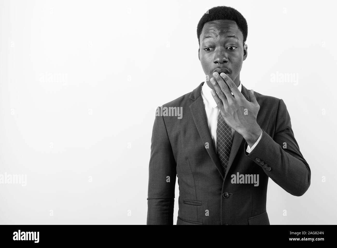 Young handsome African businessman wearing suit against white ...