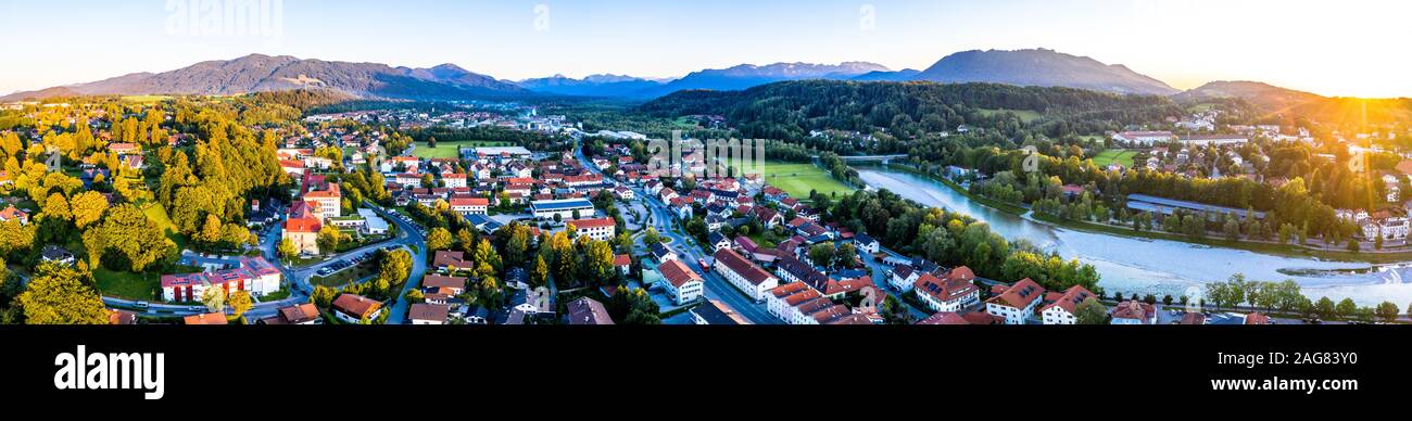 Aerial of old bavarian town Bad Toelz in Bavaria. ISar River is running through the CIty. Alps Mountains in the back. Sunset Stock Photo