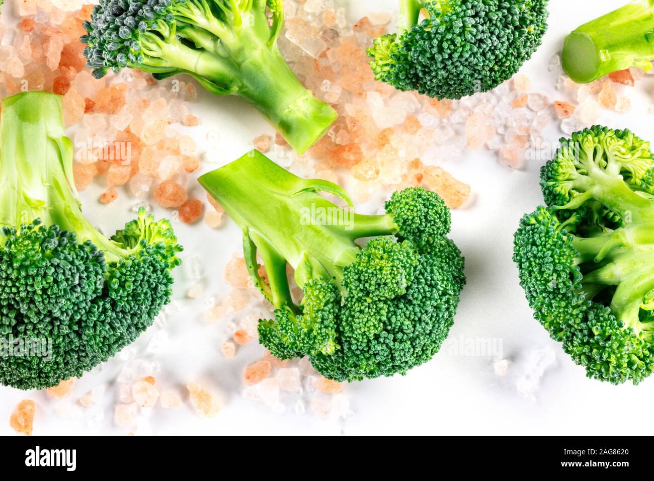 Broccoli florets close-up, shot from the top on a white background with ...