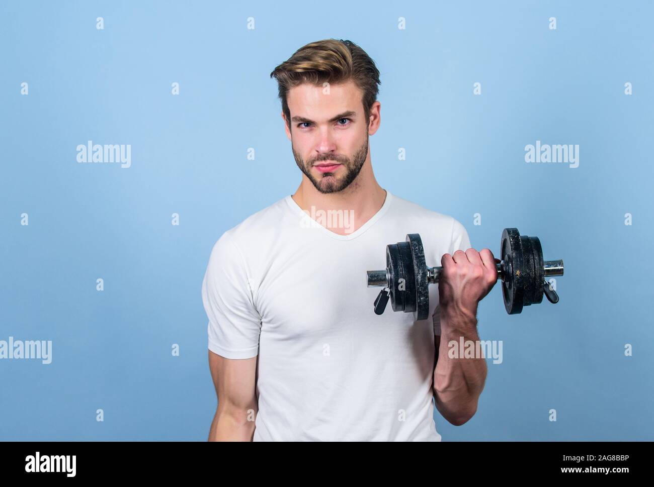 Strong muscles and power. man lifting barbell. sportsman training in