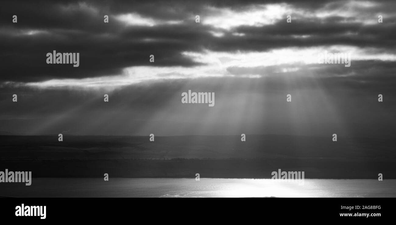 Crepuscular rays over Black Isle, Cromarty Firth Stock Photo