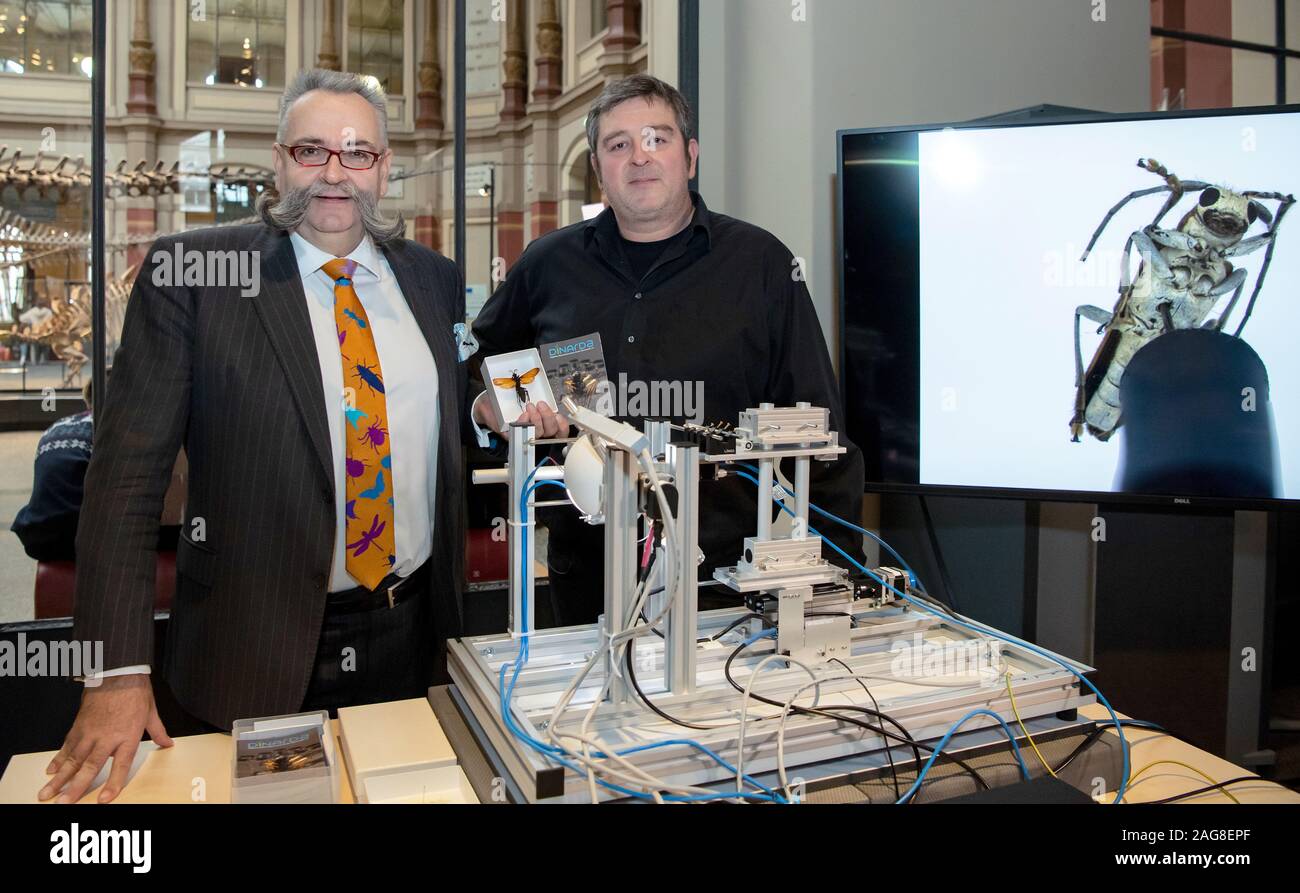 Berlin, Germany. 18th Dec, 2019. Johannes Vogel (l), General Director of the Natural History Museum, and Michael Heethoff, Chairman of the Digital Natural History Archive Darmstadt (Dinarda), are behind the scanner at the presentation of the first 3D insect scanner at the Natural History Museum in Berlin. Thanks to the latest possibilities of digitalization, a few clicks will be enough in the future to recognize every single hair of a bee. The 'Darmstädter Insektenscanner' is the only scanner so far that can digitize insects in 3D. Credit: Bernd von Jutrczenka/dpa/Alamy Live News Stock Photo