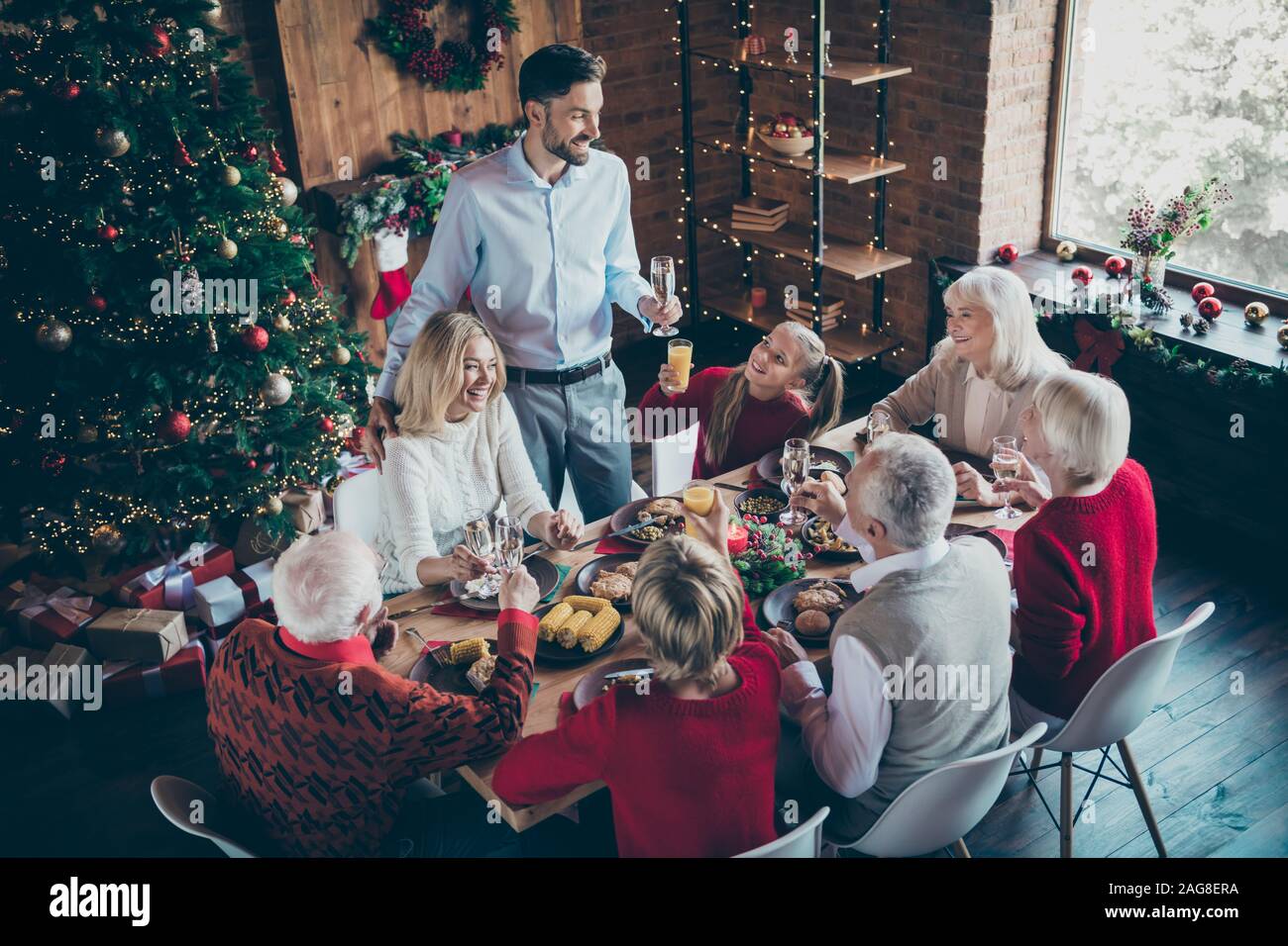 Photo Of Full Family Gathering Sit Dinner Table Father Guy Telling