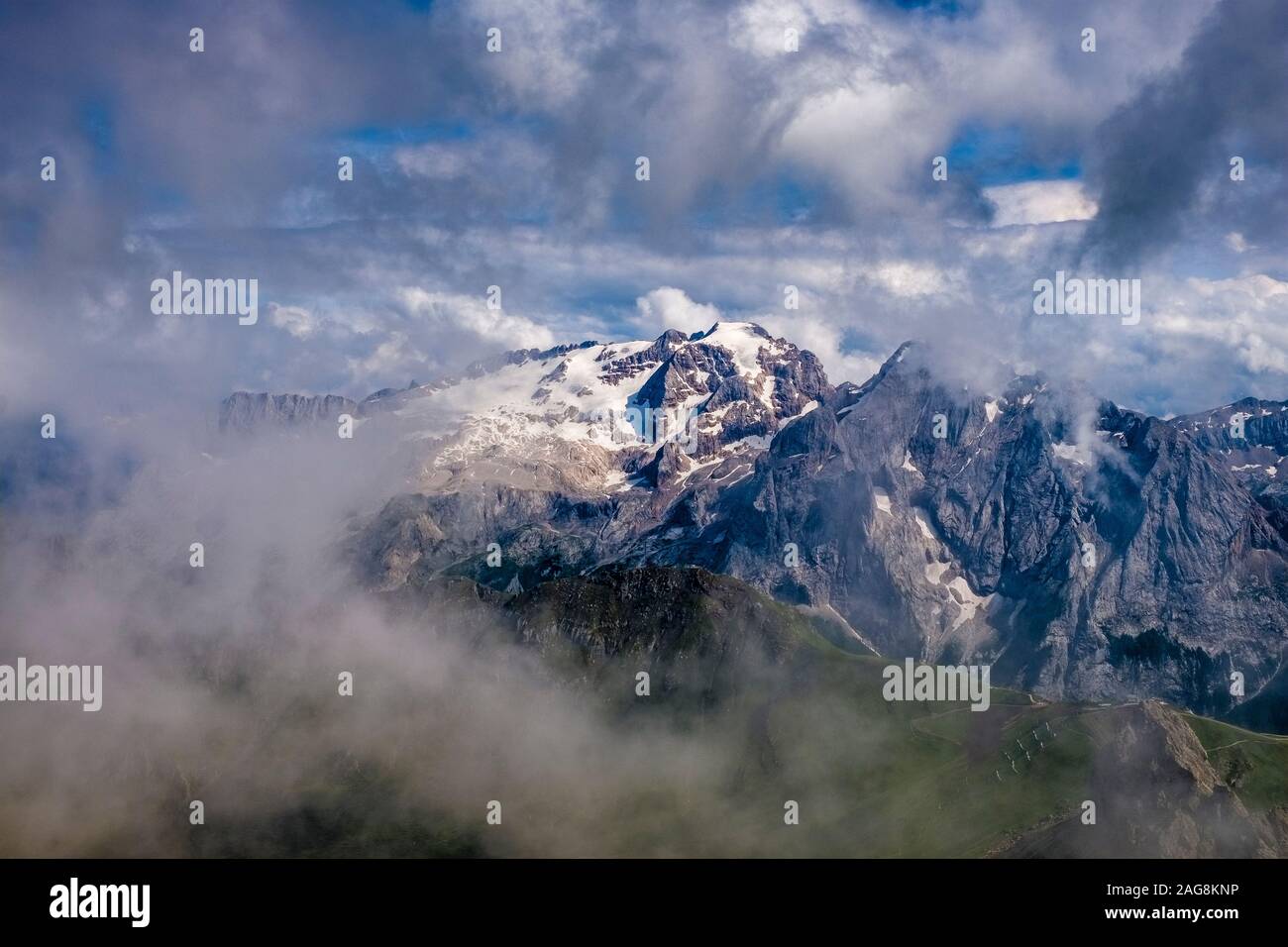 Aerial view of the summit of the mountain Marmolata, Marmolada from the plateau Sass Pordoi, dark thunderstorm clouds moving in Stock Photo