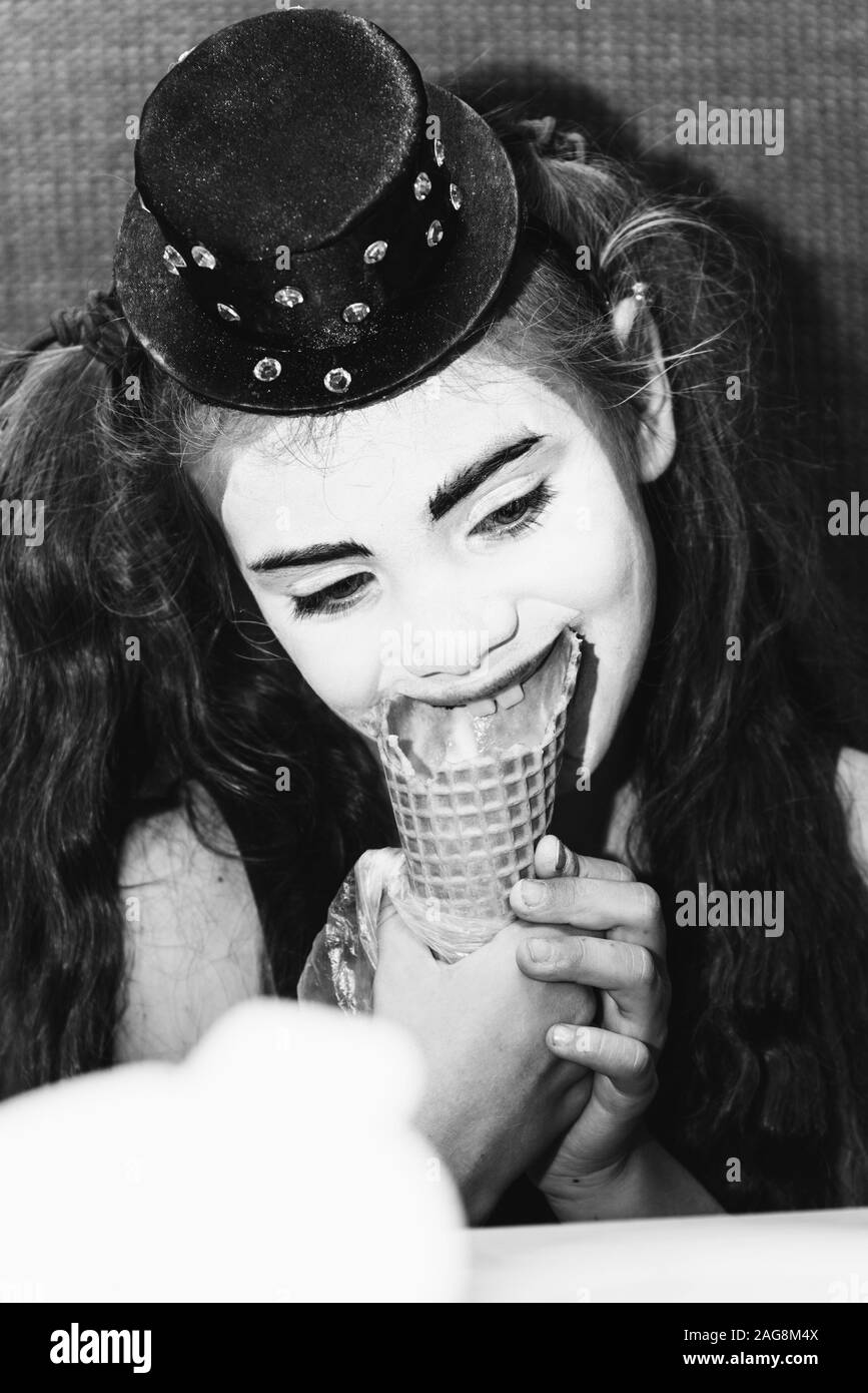 cute girl meme eats ice cream in coffee Stock Photo