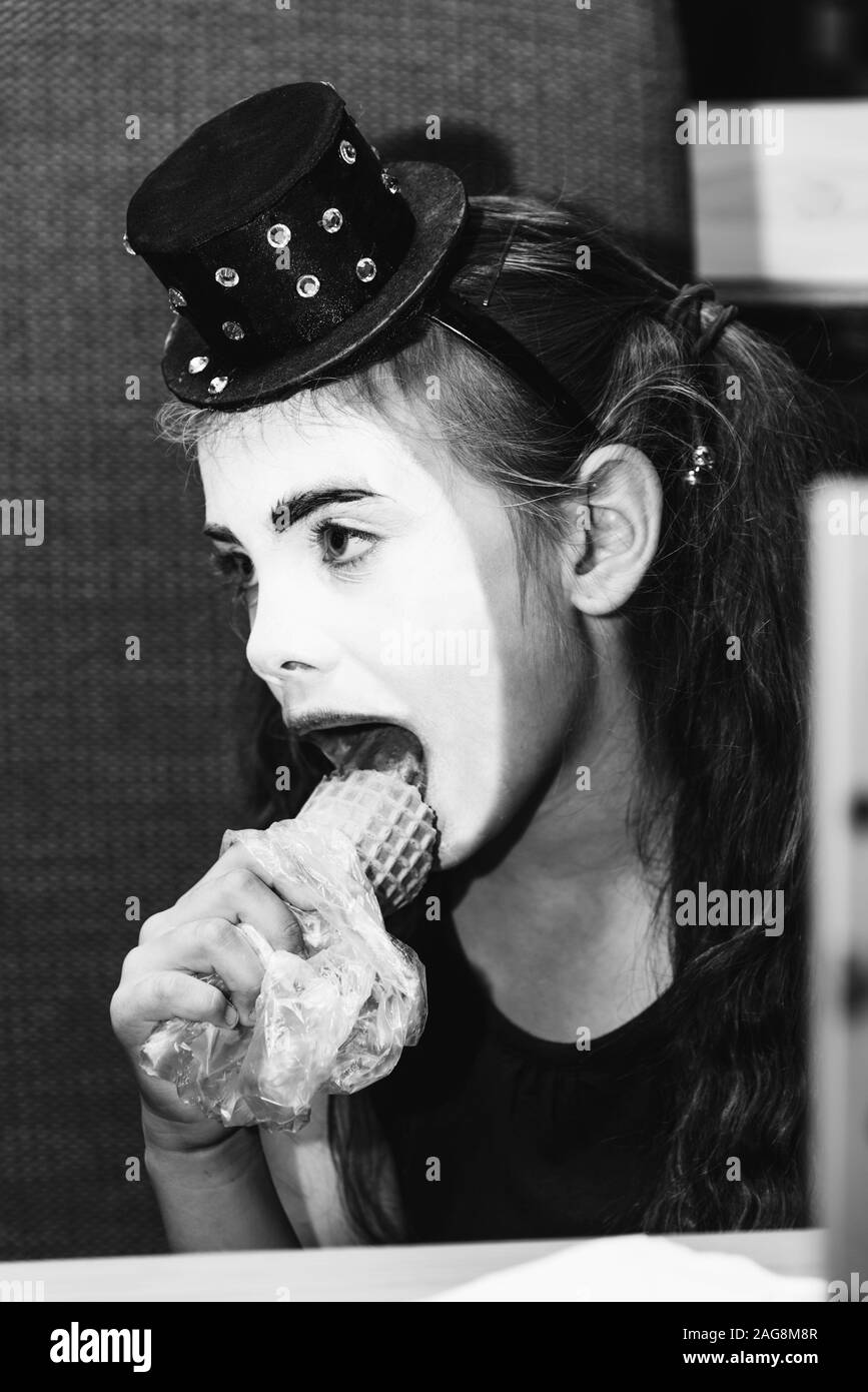 cute girl meme eats ice cream in coffee Stock Photo