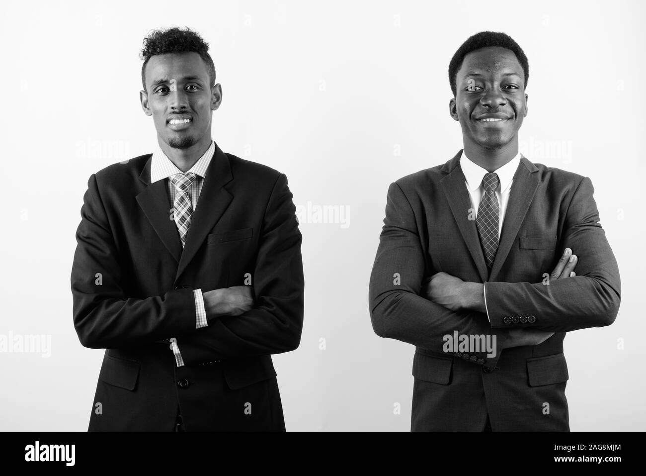 Two young African businessmen against white background Stock Photo