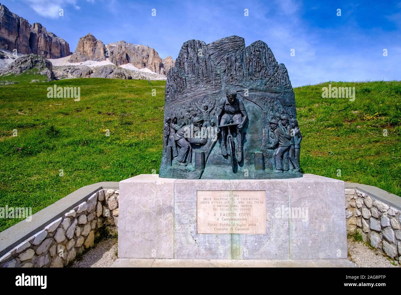 Monument for Fausto Coppi, five times winner of the bicycle race Giro d'Italia, at Pordoi pass, Passo Pordoi, the plateau Sass Pordoi in the distance Stock Photo