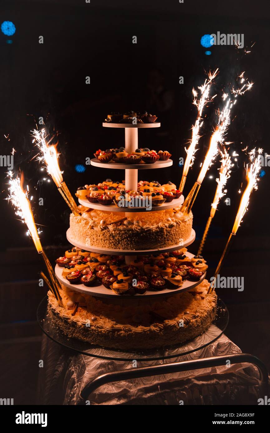 Firework candles Wedding party huge multistory cake that consists of