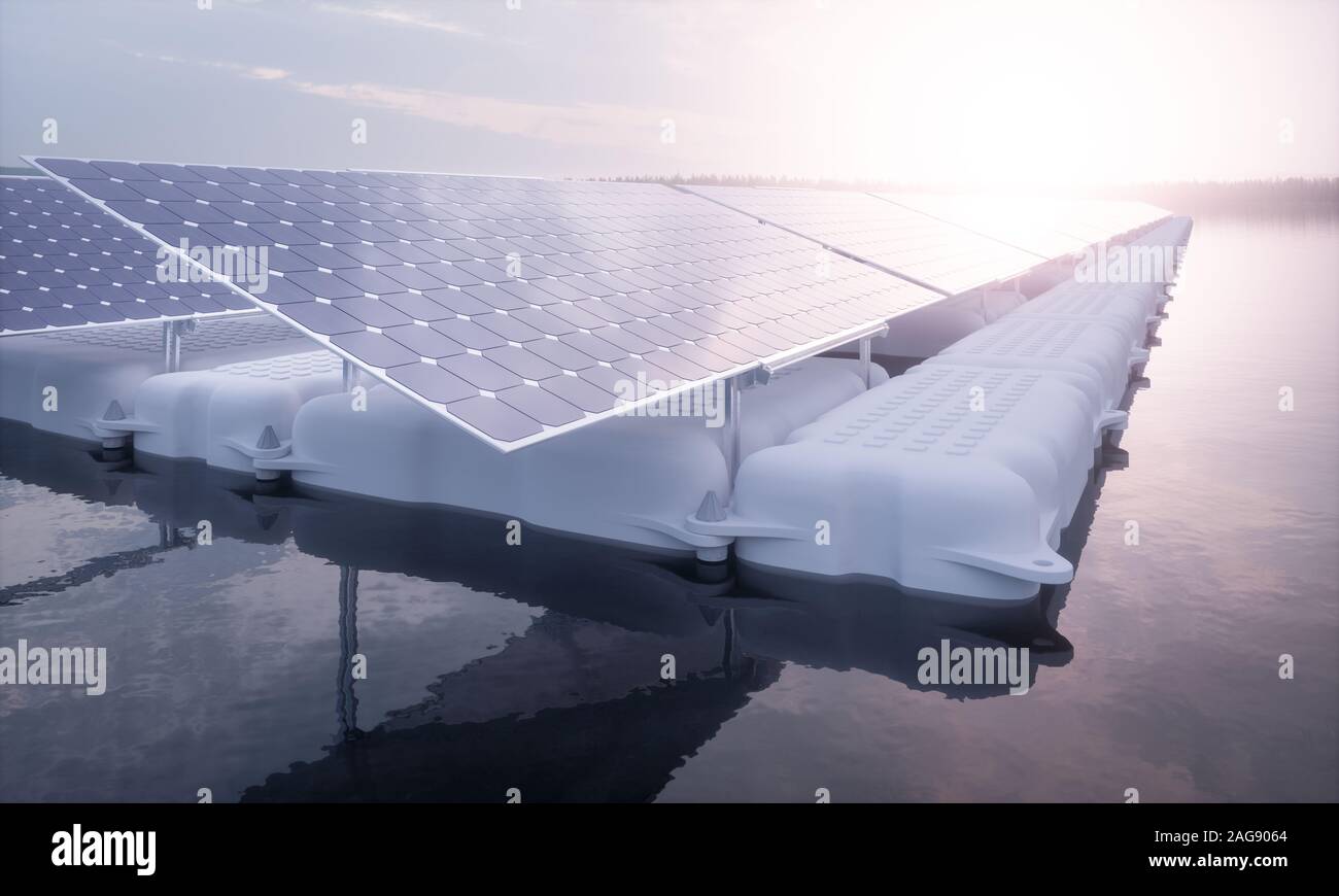 A closeup picture of a floating array of solar panels installed on a white pontoon in a magical purple morning light setting with a distant foggy fore Stock Photo