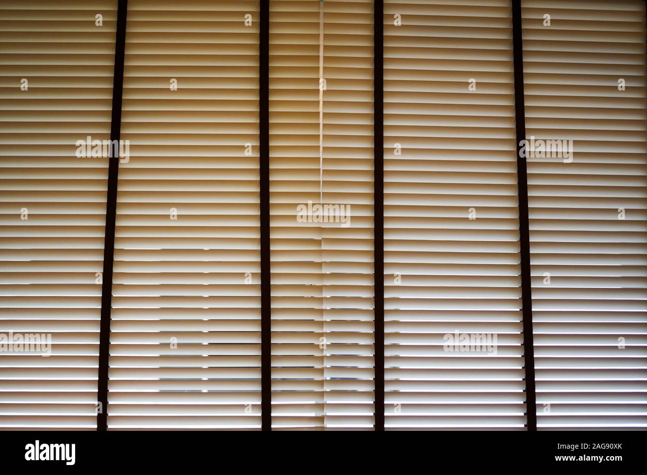 Close up of window blinds / windows jalousie / Venetian blinds / window shades shielding the interior of a room /office from outside view. To illustra Stock Photo