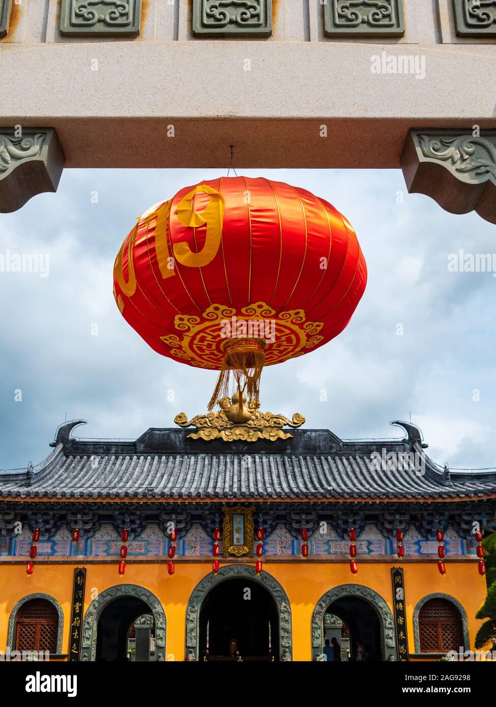 Red Chinese lantern hanging at the doorway of a Chinese Taoist temple ...