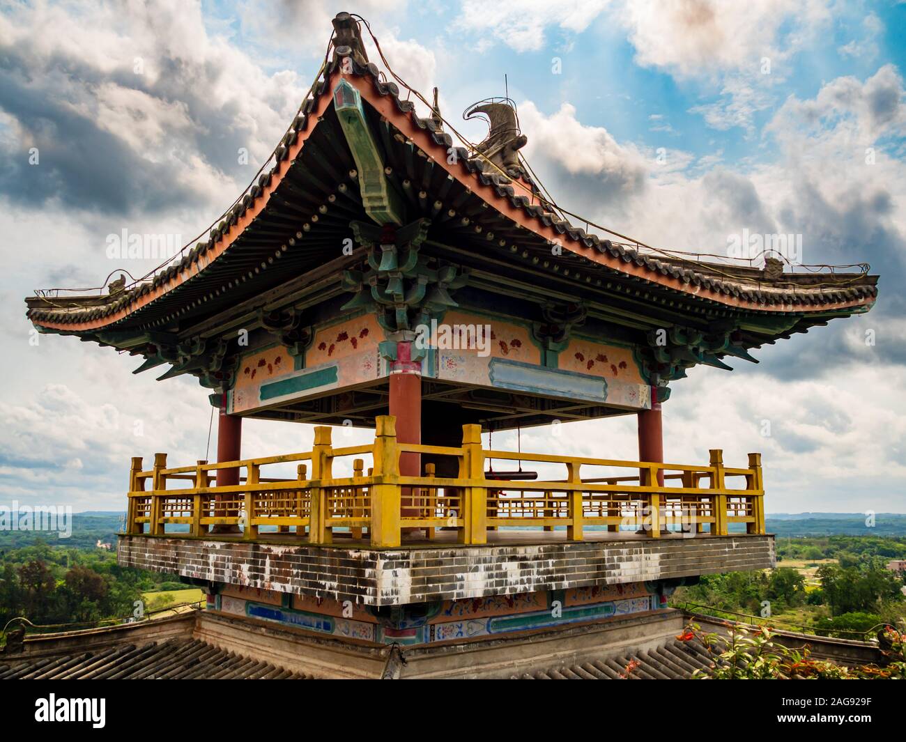 A traditional Chinese roofed pavilion / pagoda on a high mountain in Hainan, China, built in the ancient classical Chinese architecture style Stock Photo