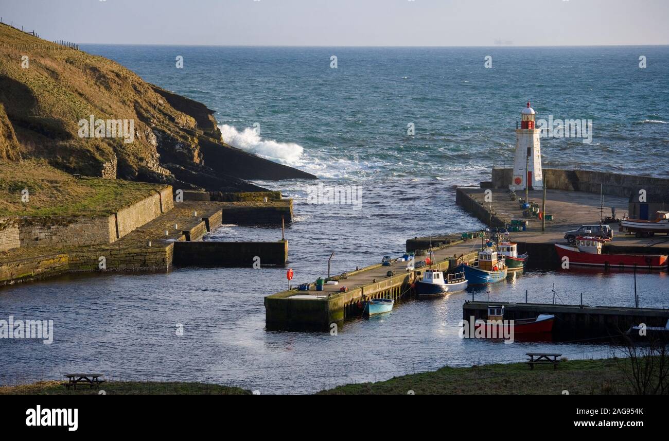 Lighthouse in Lybster Harbor at Invershore on the northeast coast of Scotland. Stock Photo