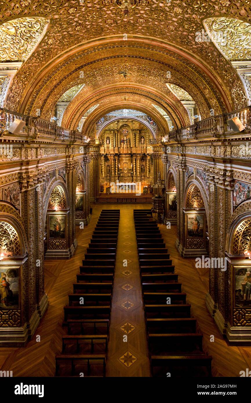 The interior of La Compania Jesuit Church in Quito in Ecuador, South America. Much of the ornate sculpture is made from local volcanic pumice which ha Stock Photo
