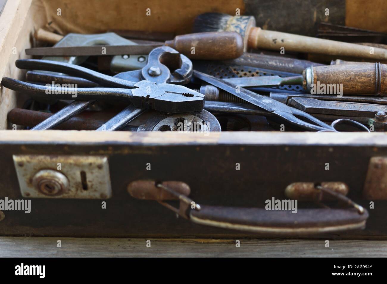 Old suitcase with the different hand metal tools Stock Photo