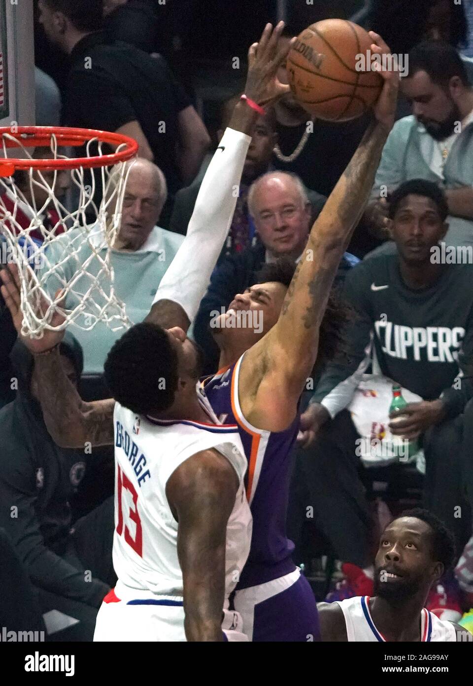 Phoenix Suns Kelly Oubre Jr dunks over Los Angeles Clippers Paul George in first quarter action at Staples Center in Los Angeles Tuesday, December 16, 2019. The Clippers defeated the Suns 120-99.  Photo by Jon SooHoo/UPI Stock Photo