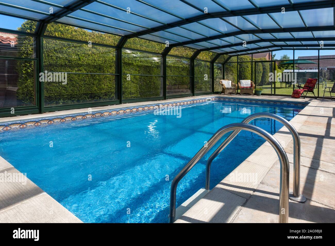 Slingsby. England. 06.08.13. Swimming pool in the garden of a large country property in Yorkshire, England. Stock Photo