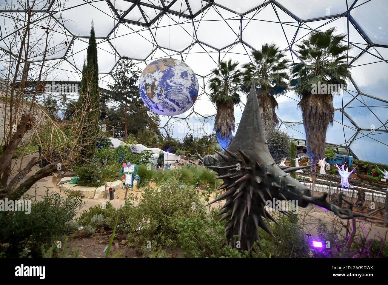 Luke Jerram's art installation 'Gaia', a replica of planet earth created using detailed NASA imagery of the Earth's surface, hangs on display at the Eden Project in St Austell, Cornwall. Stock Photo