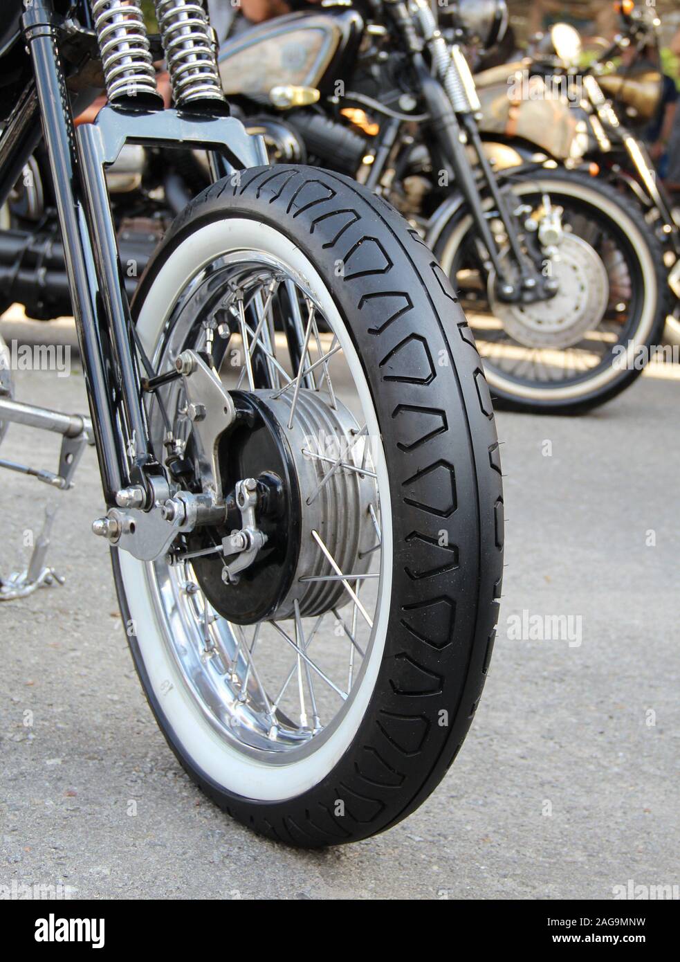 Classic White Wall Tire On The Front Wheel Of Custom Motorcycle Stock Photo