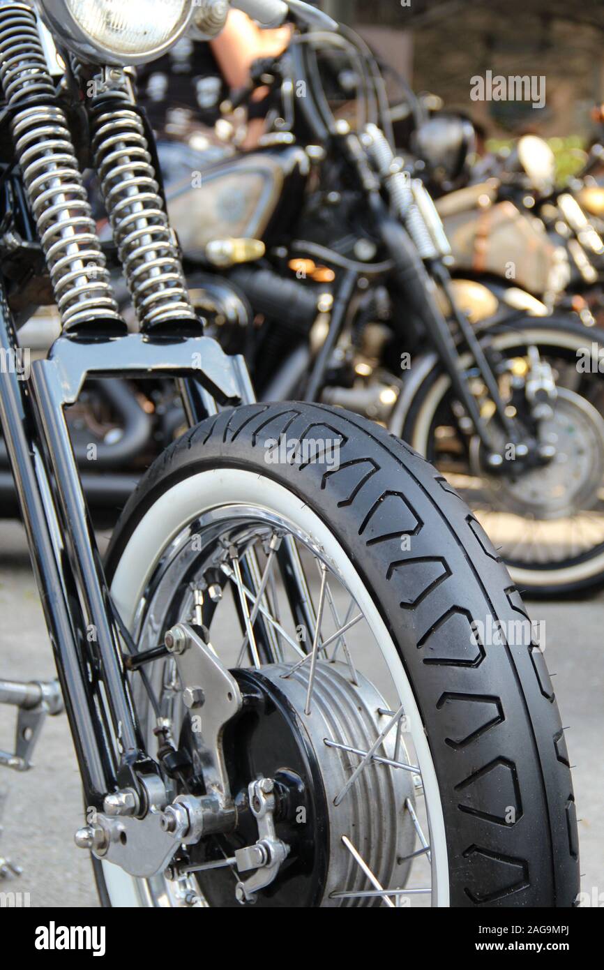 Front Fork Of Classic Motorcycle With Whitewall Tire Stock Photo