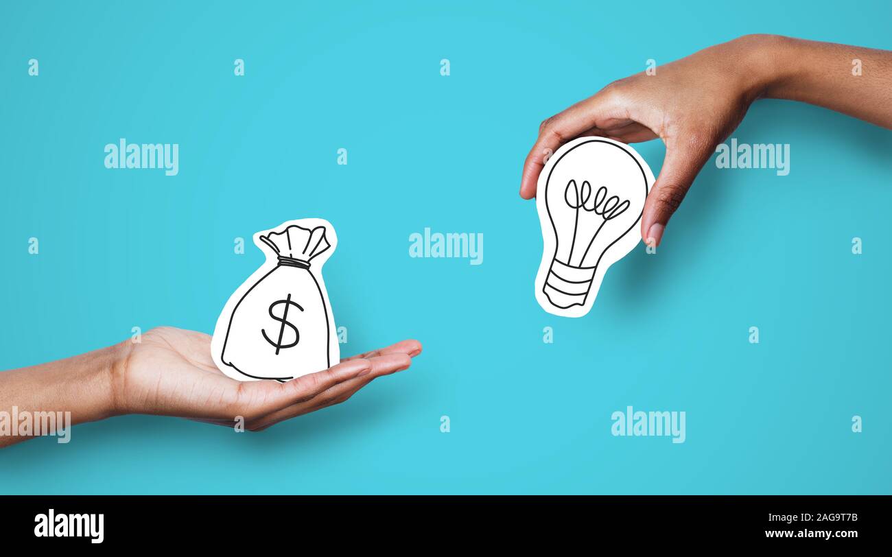 Hands with dollar sign bag and white light bulb Stock Photo