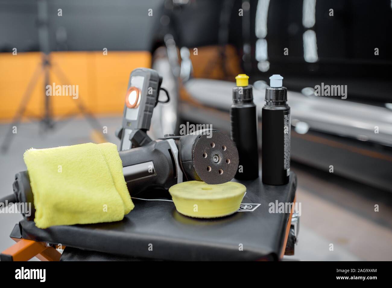 Professional equipment for automotive body polishing at the car service. Car detailing tools for vehicle care Stock Photo