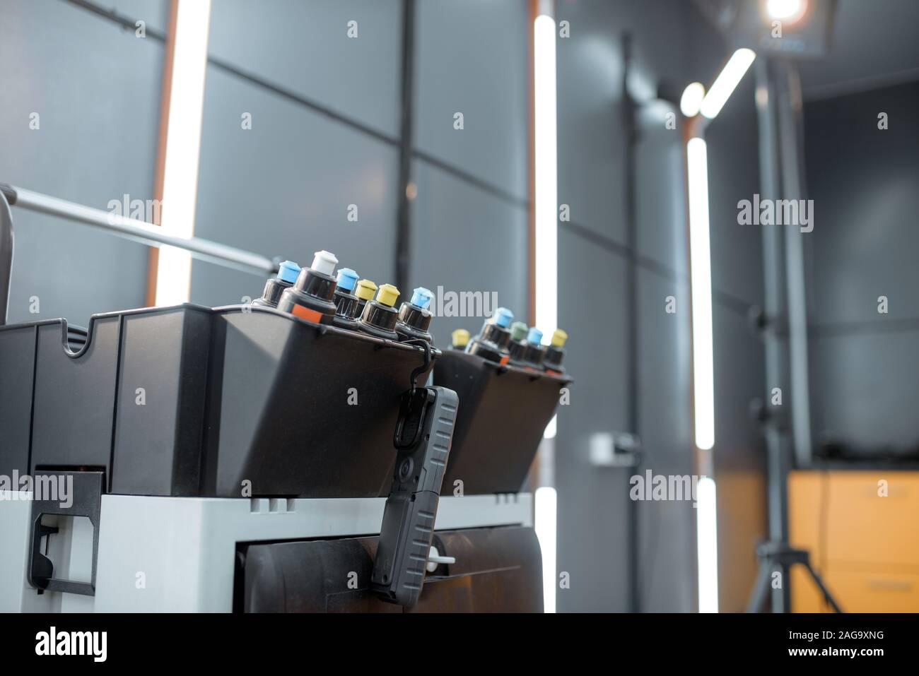 Toolbox with colorful wax tubes for car polishing at the vehicle service Stock Photo