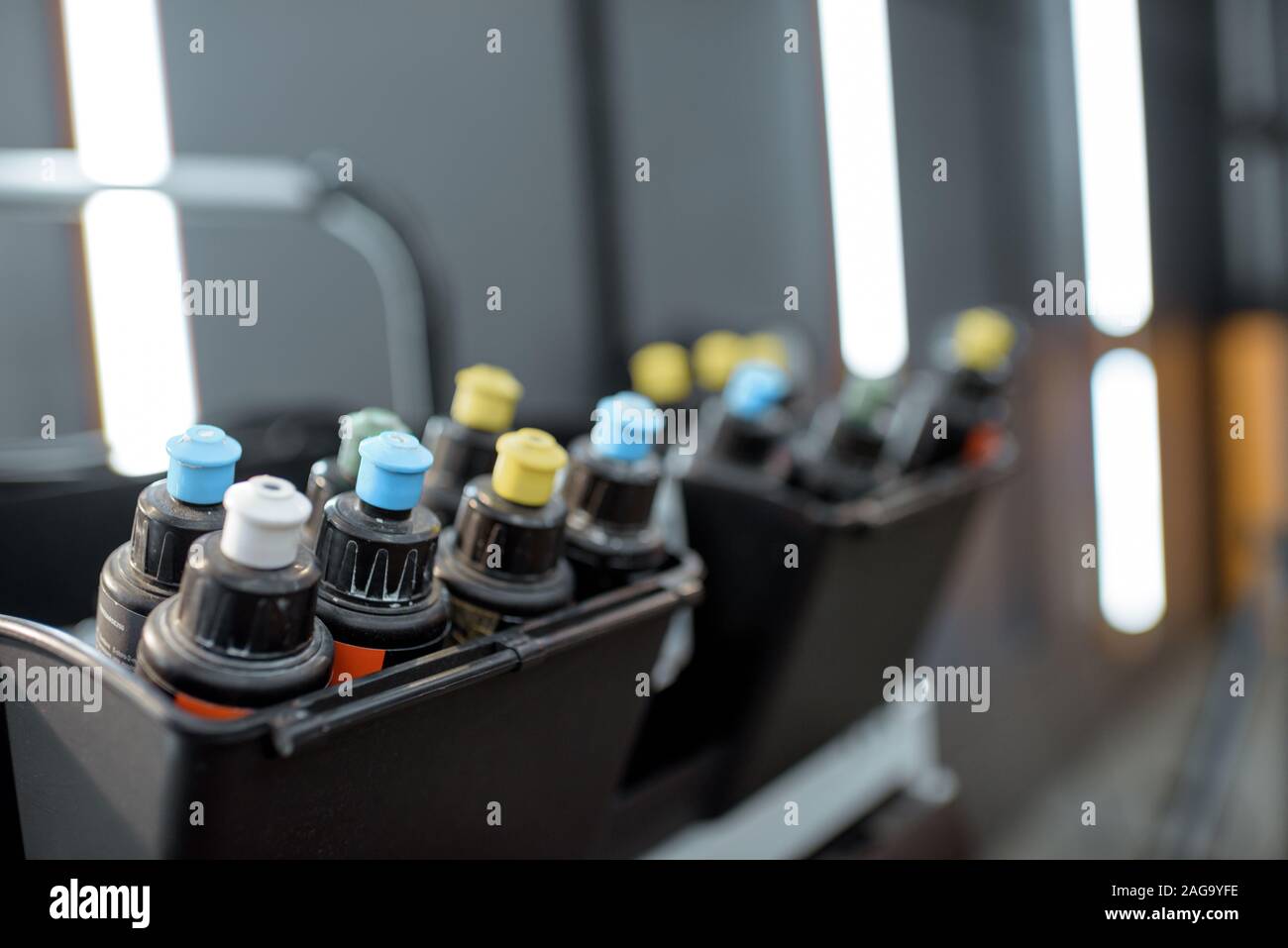 Toolbox with colorful wax tubes for car polishing at the vehicle service Stock Photo