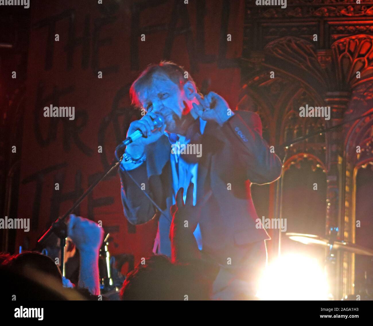 Mark E Smith & The Fall perform 15/05/2014 Manchester Cathedral gig - MES on vocals with microphone Stock Photo