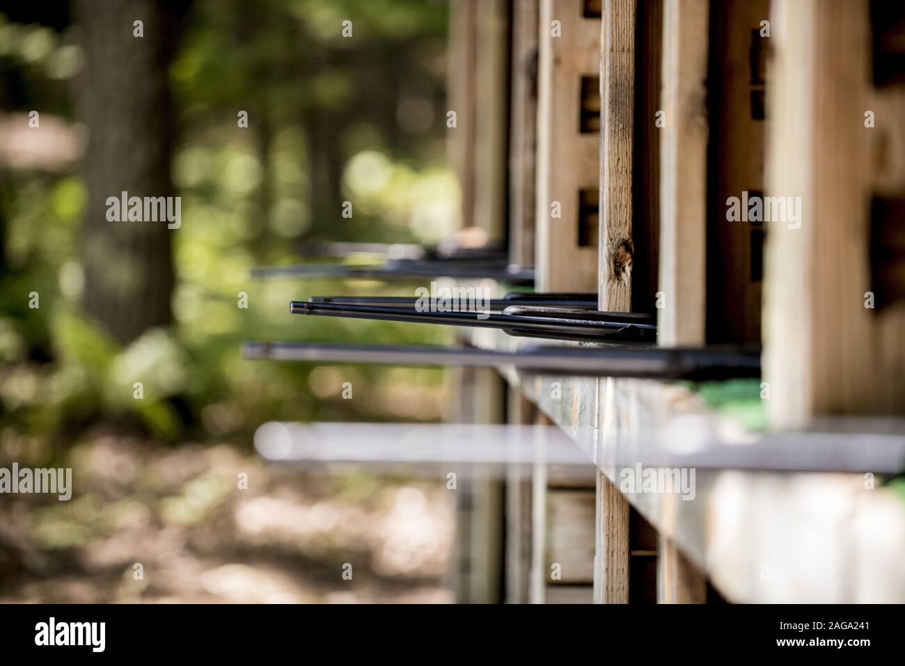 Selective focus shot of rifles at the gun range Stock Photo - Alamy