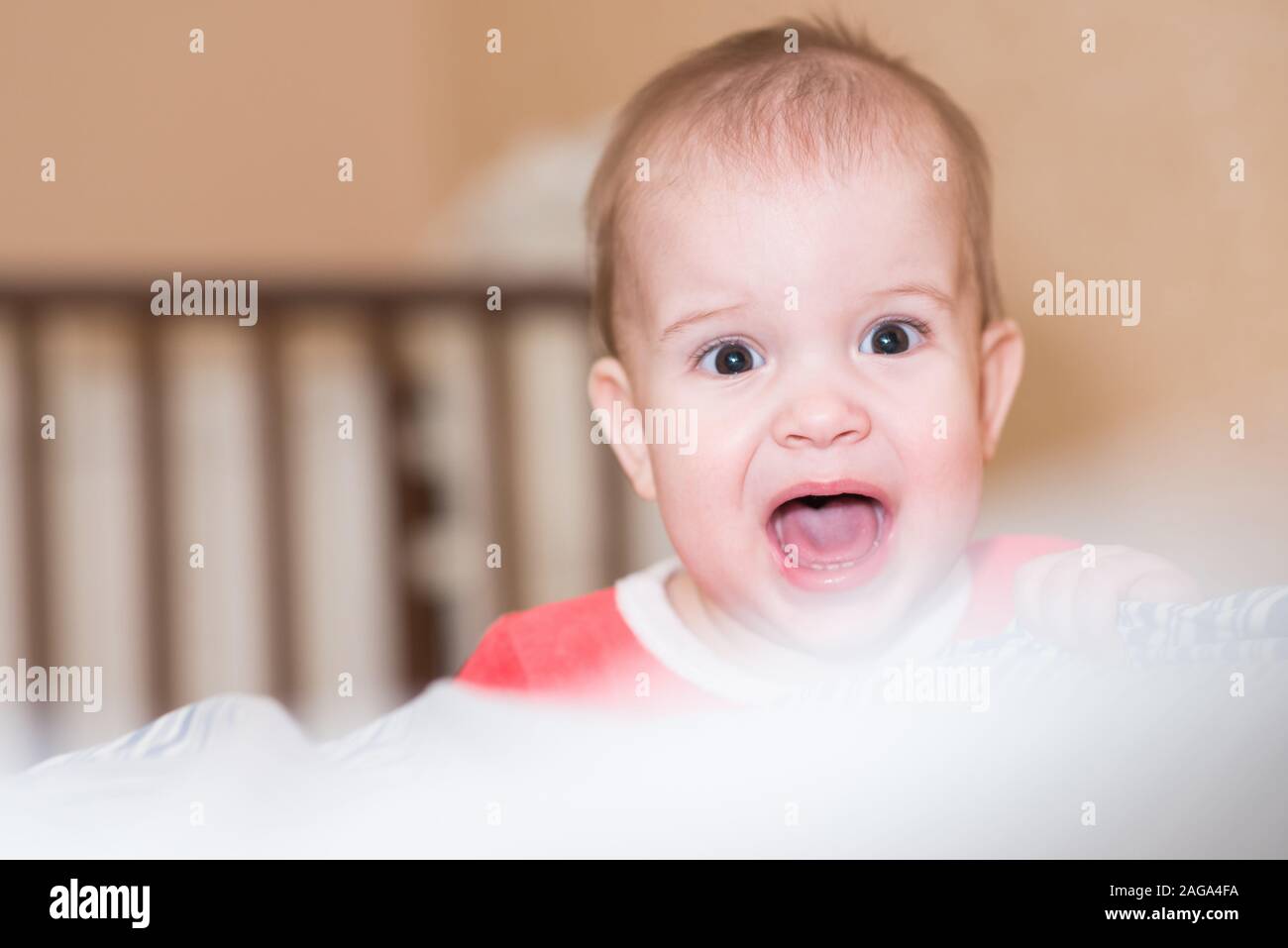 little baby crying, and angry at something Stock Photo Alamy