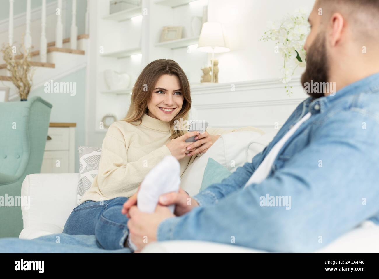 Sofa feet couple hires stock photography and images Alamy