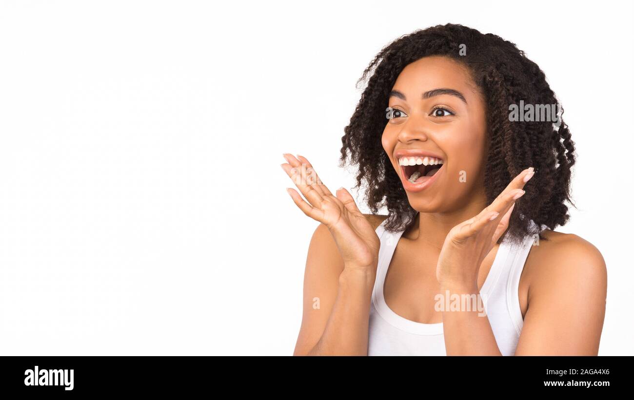 Excited black student surprised by mega sale Stock Photo