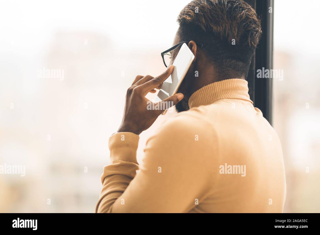 Unrecognizable black man talking on the phone Stock Photo