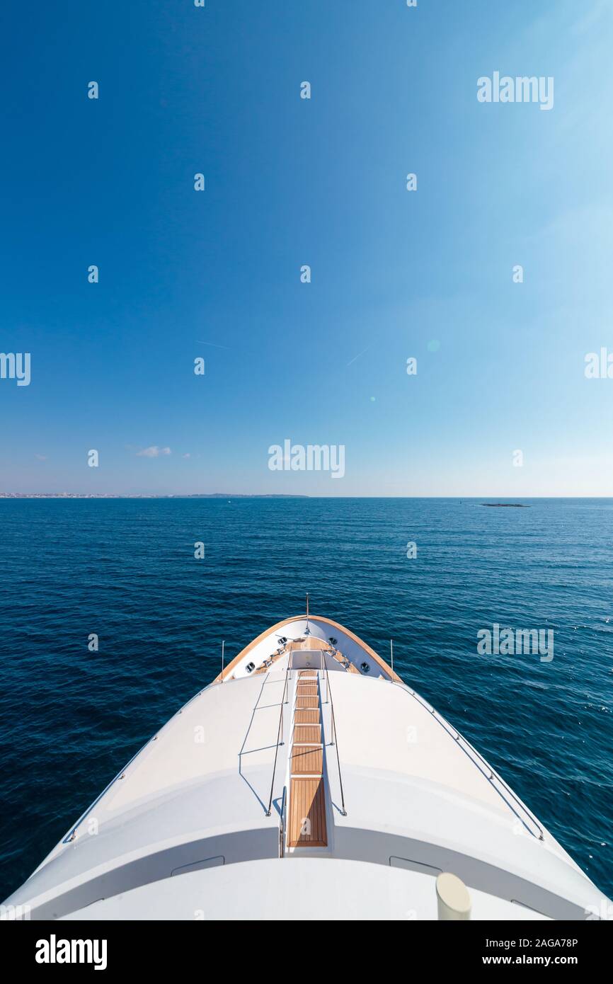 Vertical high angle shot of the board of a schooner sailing in the sea ...