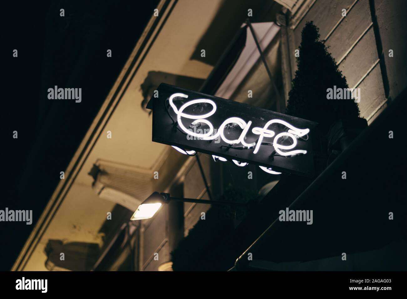 PARIS, FRANCE - Oct 12, 2015: A low angle closeup shot of a black illuminated signage with the writing Cafe in Paris Stock Photo